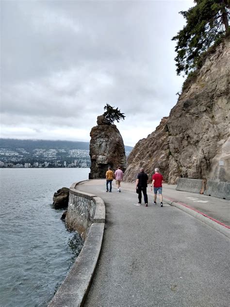 people walking on Stanley Park seawall, Vancouver, BC, Canada