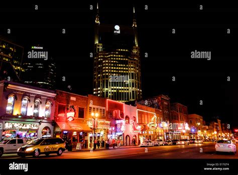 Neon signs illuminate Broadway Street at night in Downtown Nashville ...