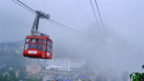 Enjoy a ropeway cable car ride over Gangtok city. Amazing aerial cityscape of Sikkim, DMC Sikkim ...