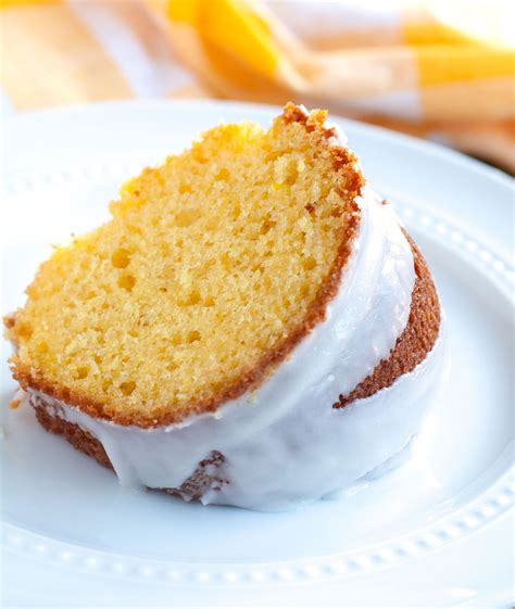 Slice of Apricot Nectar Cake on a white plate and a yellow napkin ...