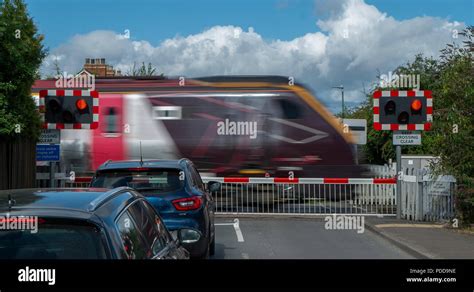 Railway Crossing, Stonehouse, Gloucestershire, UK. Drivers wait at a ...