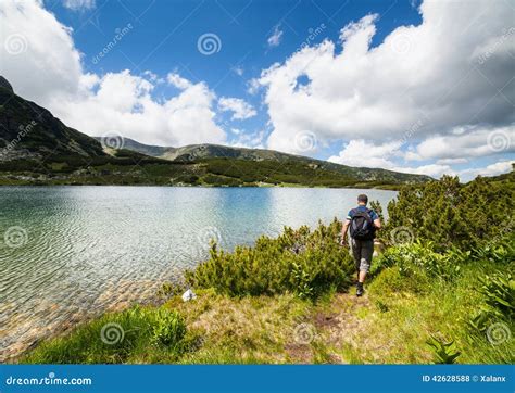 Hiking on the lakeside stock photo. Image of male, beauty - 42628588