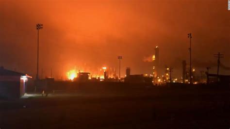 Hours after explosions rocked a Texas chemical plant, a fire continues ...