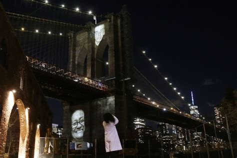 Images of New York City's COVID-19 dead projected onto Brooklyn Bridge ...