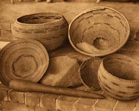 Pomo baskets, mortar, and pestle | Edward Curtis Photos