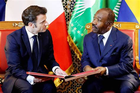 France’s Macron begins four-nation African tour - Taipei Times