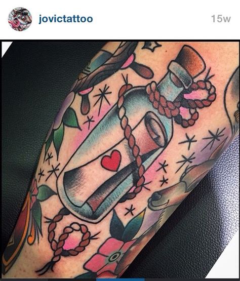 a bottle with a heart inside is sitting on the arm, surrounded by other tattoos