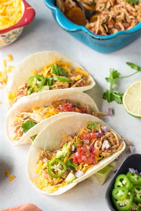 Easy shredded chicken tacos made in the slow cooker or crockpot with only a few ing… | Slow ...