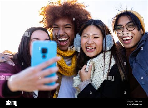 Happy group of friends taking a selfie outdoors Stock Photo - Alamy