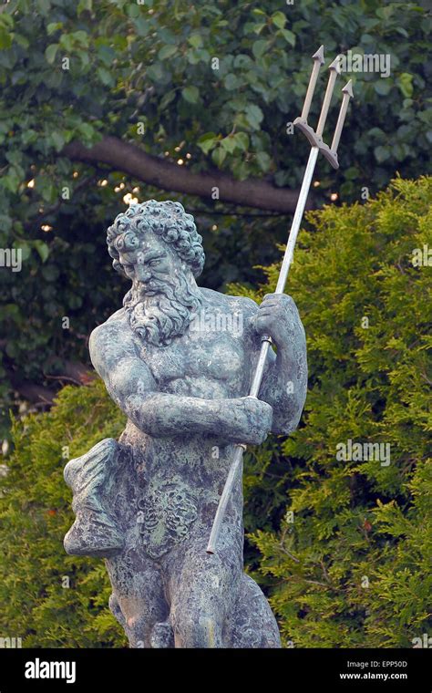 Awesome Poseidon statue with trident also known as Neptune Stock Photo - Alamy