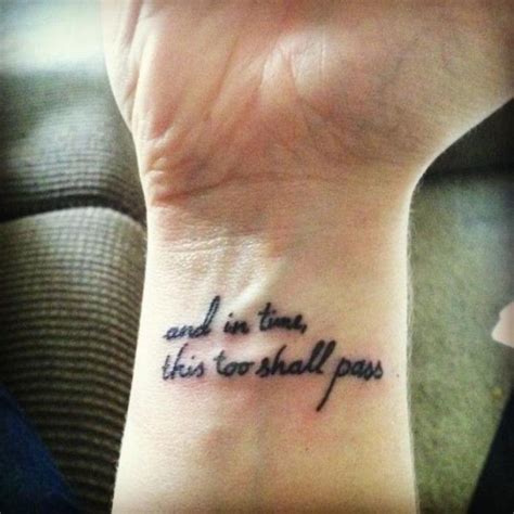 and-in-time-this-too-shall-pass-written-in-cursive-tattooed-in-black-ink-on-a-person-s-wris ...