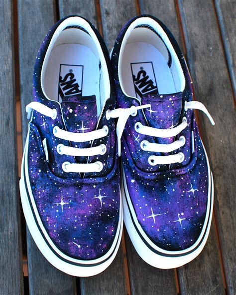 These one-of-a-kind hand-painted Vans Era shoes feature a galaxy pattern all over the shoes ...