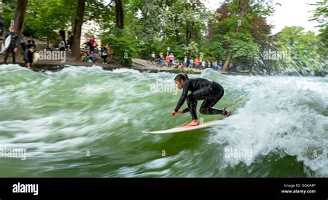 Surfer surfing on the Eisbach in the English Garden, Munich, Upper ...