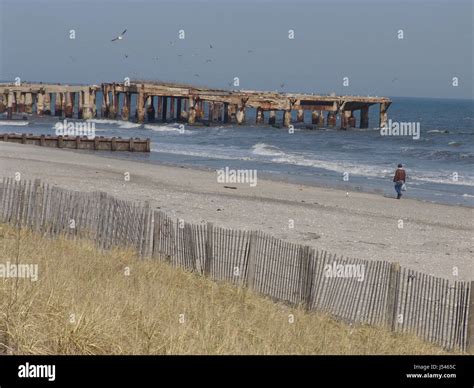 lonely man on the beach Stock Photo - Alamy