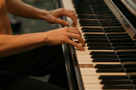 Person Playing Piano in Close Up Photography · Free Stock Photo