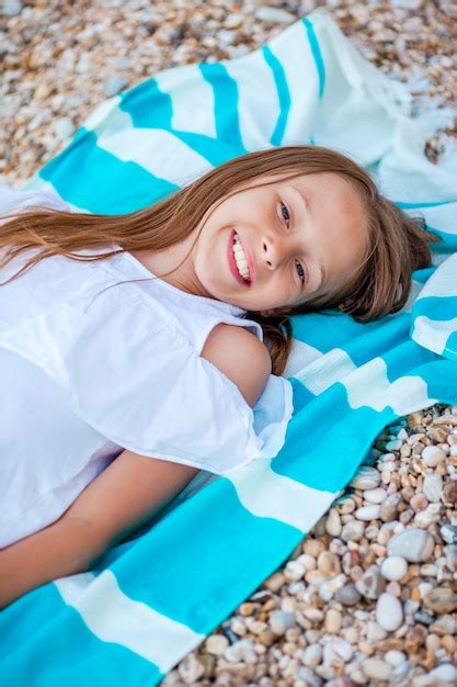 Premium Photo | Cute little girl at beach during summer vacation