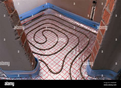 Installation of underfloor heating system in building Stock Photo - Alamy