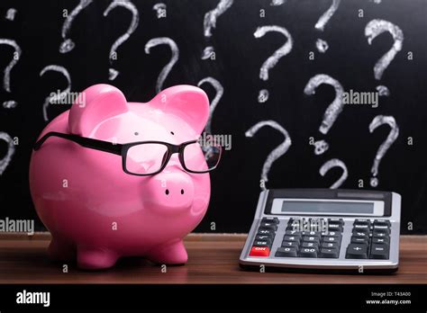 Piggy bank question mark hi-res stock photography and images - Alamy