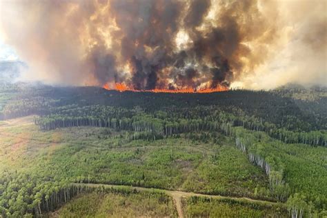 Wildfires rip across Canada as heat wave smashes temperature records