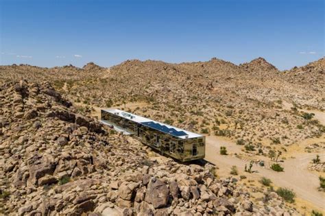 The Invisible House is a reflective building that mirrors the desert surroundings