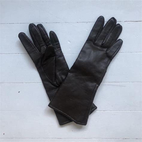 Dark brown leather gloves with wool lined inside.... - Depop