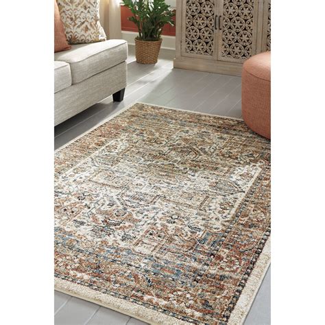 Signature Design by Ashley Traditional Classics Area Rugs Jirair Tan/Blue/Rust Medium Rug ...