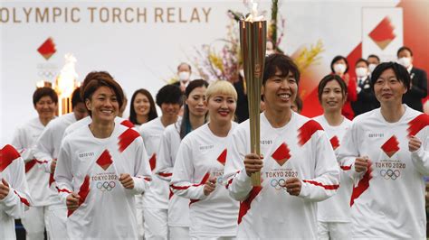 Olympic torch relay begins in Fukushima, counting down to delayed Tokyo ...