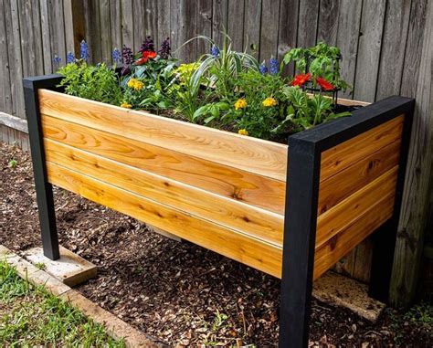 New video this week! 💀🎥 We built a modern raised planter box from cheap ...