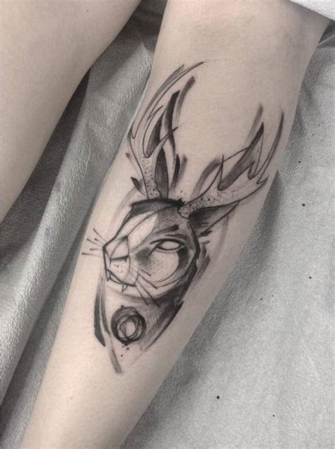 Sketchy jackalope tattoo on the calf.