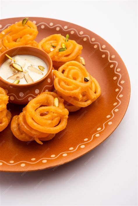 Free Photo | Rabri jalebi or imarati with rabdi made from condensing milk, famous dessert sweet ...