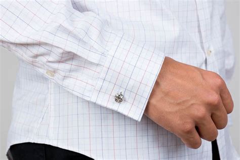 barrel cuff worn with a cufflink on a men's cotton dress shirt