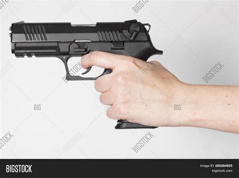 Hand Holding Gun On Image & Photo (Free Trial) | Bigstock