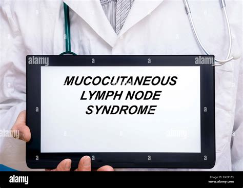 Mucocutaneous Lymph Node Syndrome. Doctor with rare or orphan disease text on tablet screen ...