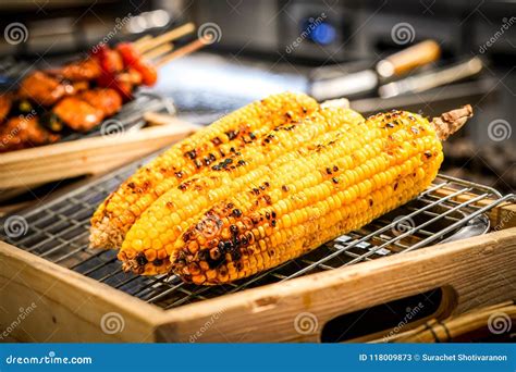 Grilled Corn on the Grill with Blur BBQ beside. Stock Image - Image of ...