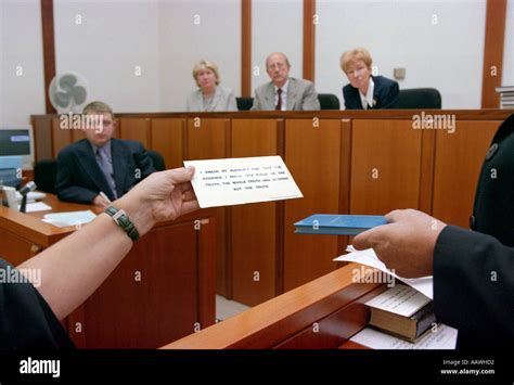 taking the oath to give evidence on witness stand at magistrate s court UK Stock Photo - Alamy