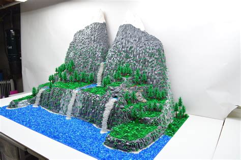 a sculpture made out of legos is displayed on a table in front of a ...