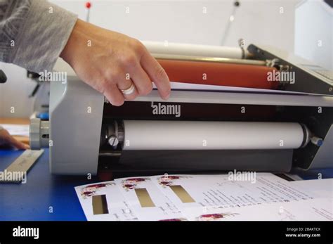 Plastic laminating machine Stock Photo - Alamy