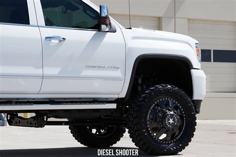 White Stylish GMC Sierra on Contrasting Custom Wheels — CARiD.com Gallery