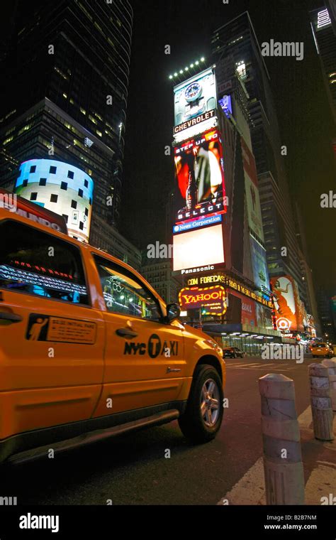 Yellow taxi cab at night in Times Square - New York City, USA Stock Photo - Alamy