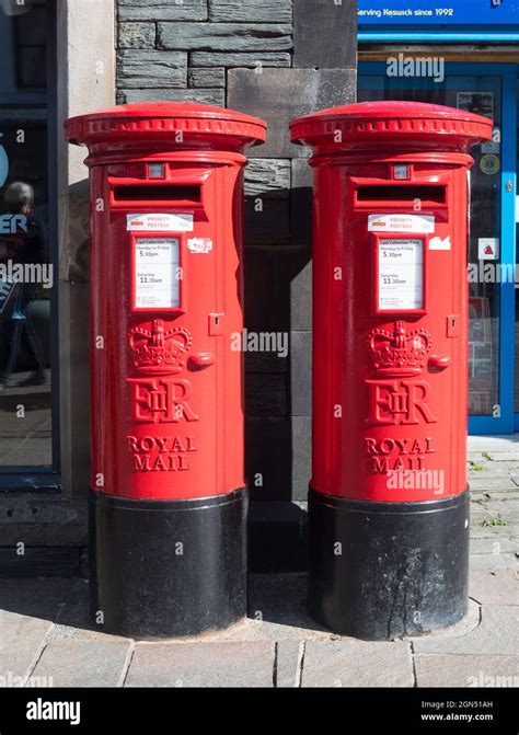 Two Royal Mail post boxes side by side in Keswick, Cumbria, England, UK Stock Photo - Alamy