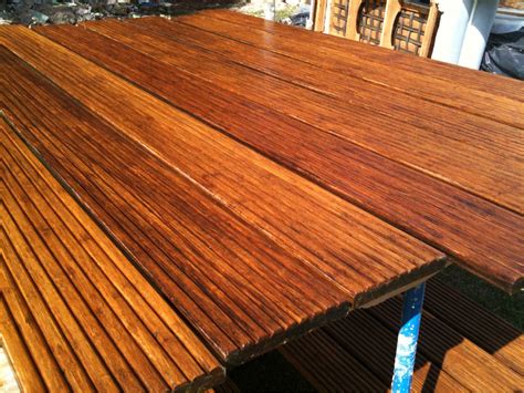 a close up of a wooden table outside