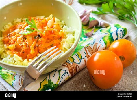 Steamed rice with stewed vegetables and turmeric Stock Photo - Alamy