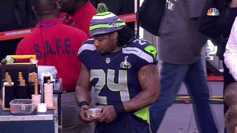 Marshawn Lynch fuels up with sideline Skittles before the Super Bowl ...