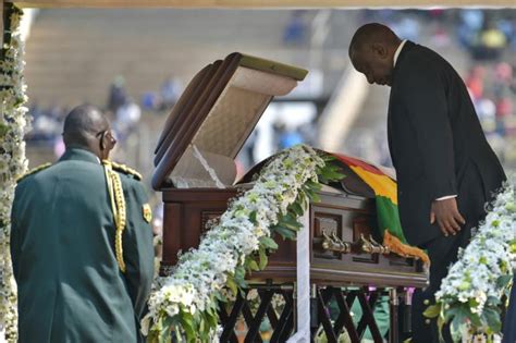 Jeered over attacks, S.Africa's president apologises at Mugabe funeral