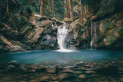 Waterfall in rocky ravine on painted picture · Free Stock Photo