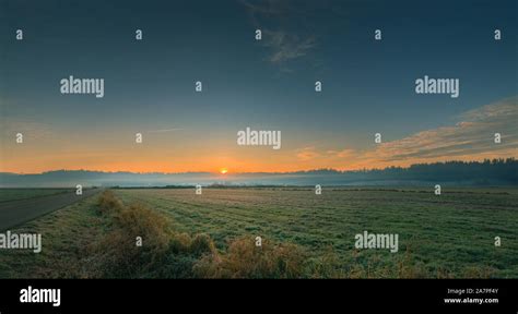 Sunrise over farm field hi-res stock photography and images - Alamy