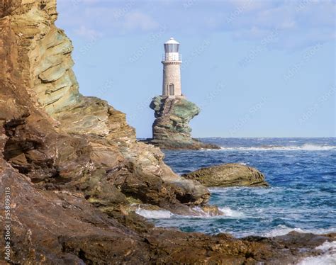 Tourlitis lighthouse in andros island, greece Stock Photo | Adobe Stock