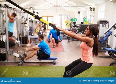 People Working Out on Fitness Equipment at a Busy Gym Stock Image - Image of african, clothing ...