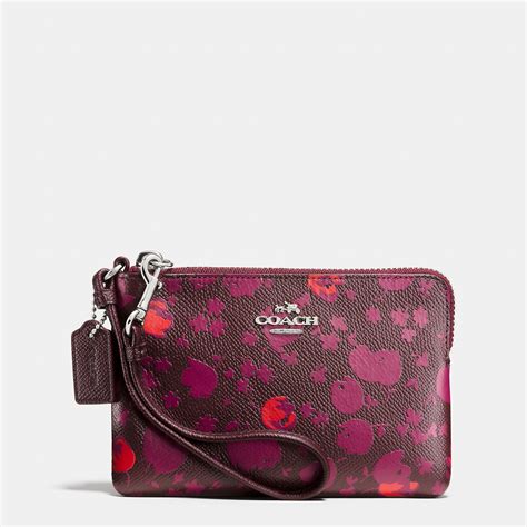 COACH Corner Zip Wristlet In Floral Print Leather in Pink - Lyst