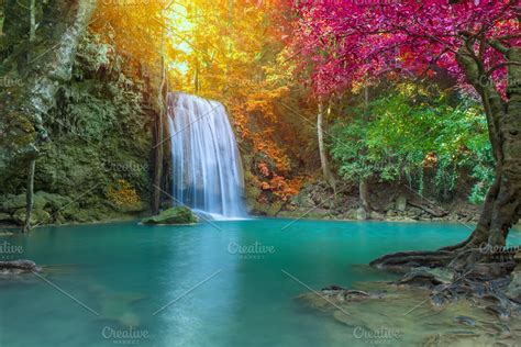 Erawan waterfall in deep forest containing waterfall, blue lagoon, and ...